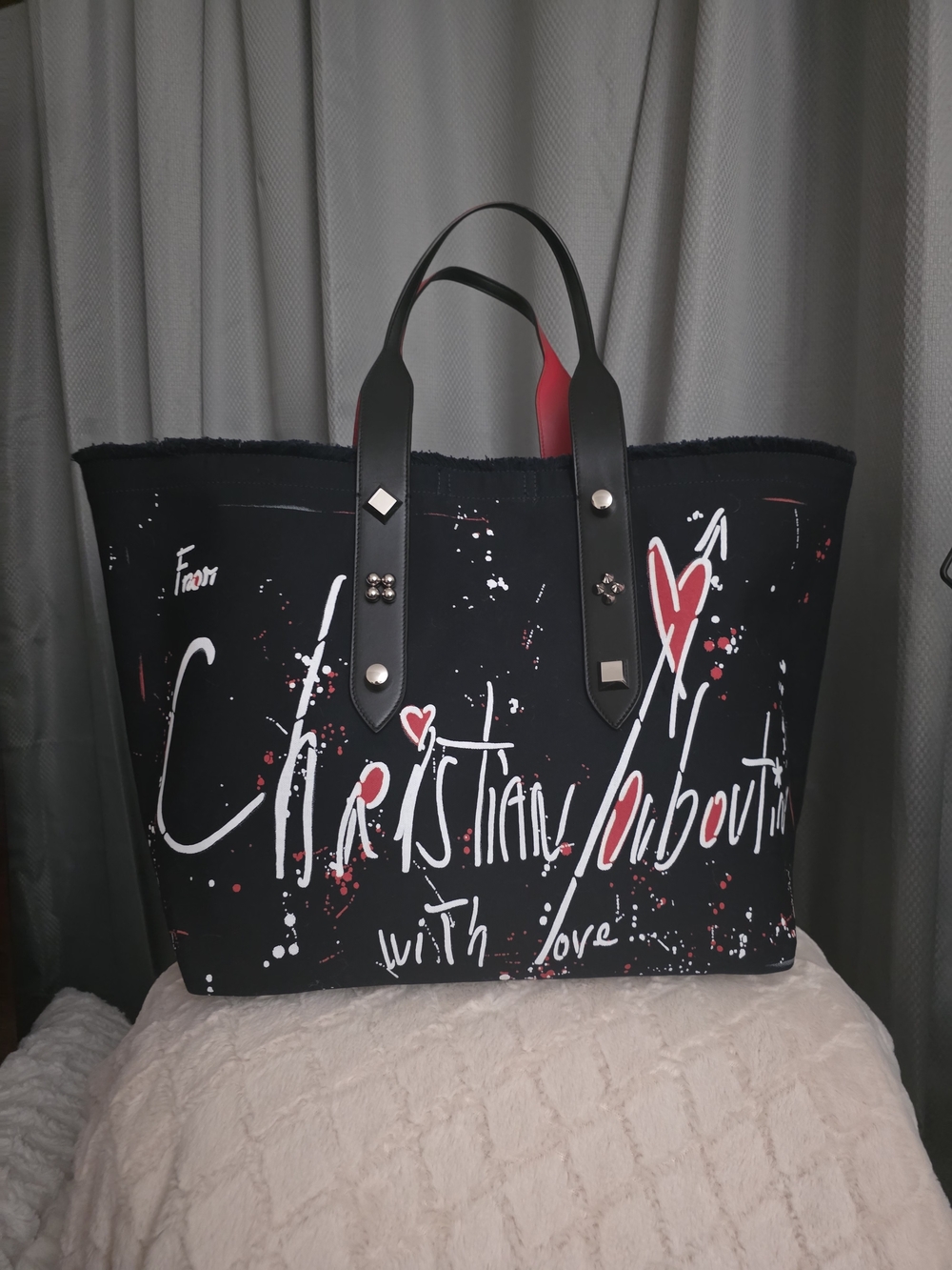Christian Louboutin- Black Canvas Tote with Red Accents.
